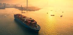 Aerial view Container cargo ship full carrier container at Terminal commercial port Transporting shipment container for business logistics, import export, shipping or freight transportation.